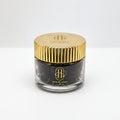 Jar of Oud Al Amal with gold lid on a white background